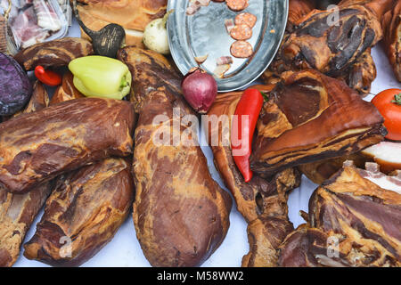 Various products from dried meat exposed to view and tasting before sale. Stock Photo