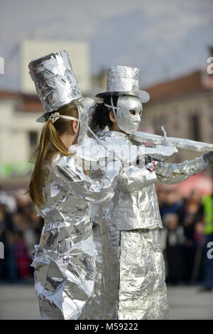 unrecognizable man wrapped with aluminium foil, violin players Stock Photo
