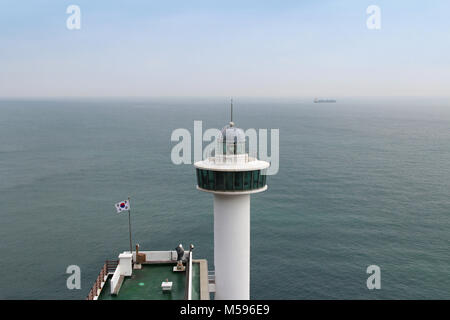 Yeongdo Lighthouse with the Korea flag at Taejongdae park, Busan, South Korea Stock Photo