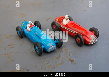 Talbot Lago and Alfa Romeo vintage Dinky toys on an old rusty metal garden table Stock Photo