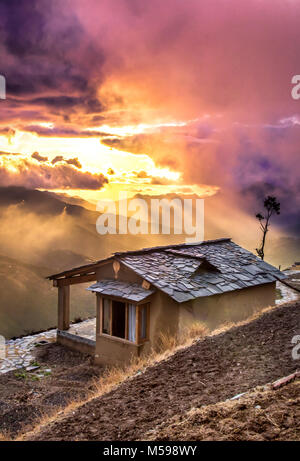 Burst of clouds during sunset on one fine rainy day Stock Photo