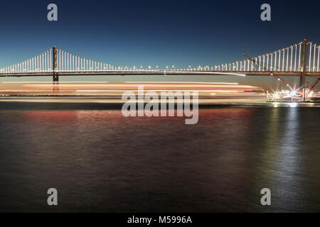 The San Francisco-Oakland Bay Bridge With Illuminations (The Bay Lights), At Dawn. Stock Photo