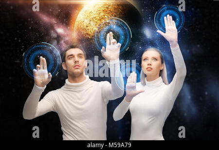 couple using touch screen over space background Stock Photo