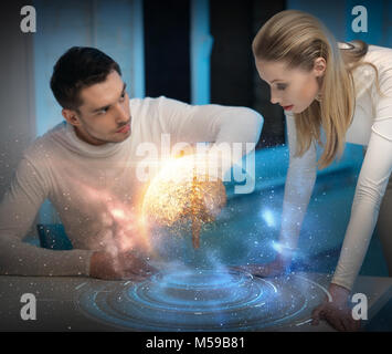 couple using touch screen over space background Stock Photo