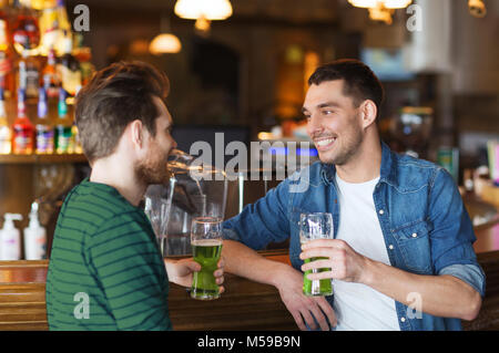 Group of male friends celebrating St. Patrick day with Irish flag Stock ...