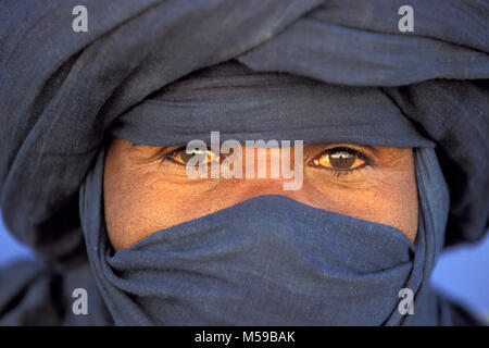 Libya. Ghat, Sahara desert. Man of Tuareg tribe wearing traditional headdress. Portrait. Stock Photo