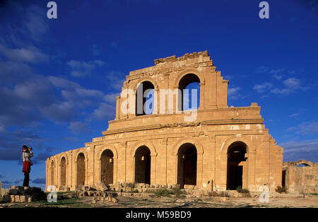 Libya. Tripoli. Sabratha. (Sabrata). Roman ruins. Tourist taking photograph. Unesco, World Heritage Site. Archaeological Site of Sabratha. Stock Photo