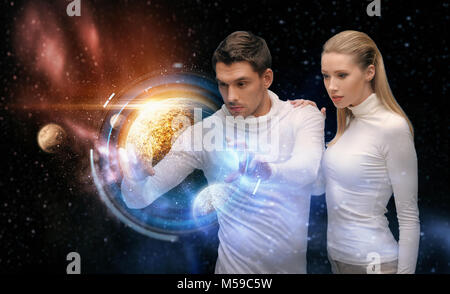 couple with planet hologram over space background Stock Photo