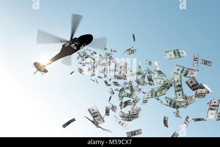 helicopter dropping money in sky Stock Photo