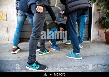 A group of boys bullies a peer in Rome  Featuring: Atmosphere, Bullying, Bullies Where: Rome, Italy When: 20 Jan 2018 Credit: IPA/WENN.com  **Only available for publication in UK, USA, Germany, Austria, Switzerland** Stock Photo