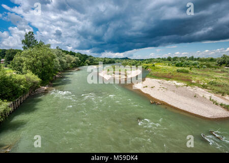 Dark clouds over Prut river seen from highway bridge near Luzhany, Bukovina region, Chernivtsi Oblast, Ukraine Stock Photo