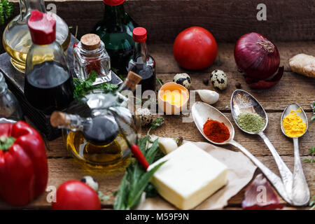 Various spices, oils and sauces selection on wooden background. Stock Photo