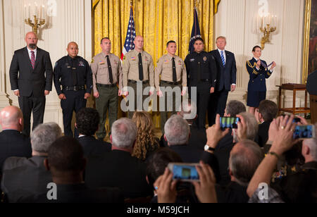 United States President Donald J. Trump stands with District Attorney Investigator Chad Johnson, San Bernardino County District Attorney's Office(left), Detective Brian Olvera, San Bernardino Police Department(2nd left), Deputy Shaun Wallen, San Bernardino County Sheriff's Department(3rd left), Detective Bruce Southworth, San Bernardino County Sheriff's Department(3rd right), Corporal Rafael Ixco, San Bernardino County Sheriff's Department(2nd right) and Officer Nicholas Koahou, Redlands Police Department(right) as recipients of the Public Safety Medal of Valor during a ceremony at The White H Stock Photo