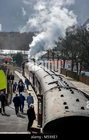 Bury, East Lancashire. 21st Feb, 2018. UK Weather.Another fine day for visitors riding on the volunteer run East Lancashire Railway today. A bumper crowd was expected to tour the line from Bury to Rawtenstall during the half-term holidays. Pulling the carriages was the locomotive 'The Crab' 13056. Stopping at Ramsbottom Station to offload passengers. Picture by Paul Heyes, Wednesday February 21, 2018. Credit: Paul Heyes/Alamy Live News Stock Photo