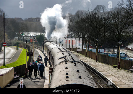 Bury, East Lancashire. 21st Feb, 2018. UK Weather.Another fine day for visitors riding on the volunteer run East Lancashire Railway today. A bumper crowd was expected to tour the line from Bury to Rawtenstall during the half-term holidays. Pulling the carriages was the locomotive 'The Crab' 13056. Stopping at Ramsbottom Station to offload passengers. Picture by Paul Heyes, Wednesday February 21, 2018. Credit: Paul Heyes/Alamy Live News Stock Photo