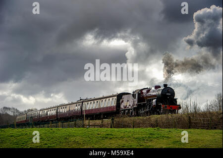 Bury, East Lancashire. 21st Feb, 2018. UK Weather.Another fine day for visitors riding on the volunteer run East Lancashire Railway today. A bumper crowd was expected to tour the line from Bury to Rawtenstall during the half-term holidays. Pulling the carriages was the locomotive 'The Crab' 13056. Halting at the Burrs Country Park stop. Picture by Paul Heyes, Wednesday February 21, 2018. Credit: Paul Heyes/Alamy Live News Stock Photo