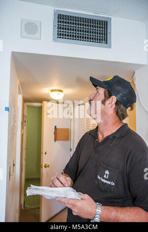 Miami Beach Florida,Presidential Condominiums,fire alarm system inspector,checks speaker,man men male adult adults,employee worker workers working sta Stock Photo