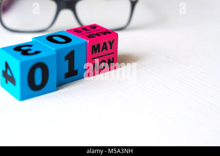 perpetual calendar made with plastic colored cubes. Set on may 1st Stock Photo