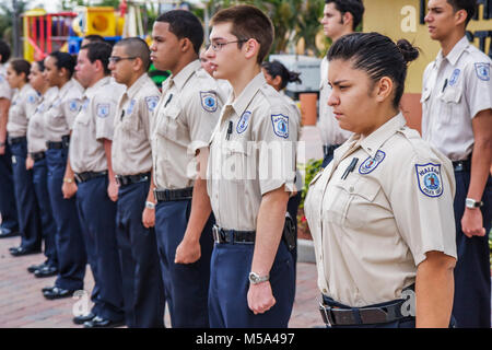 Miami Florida,Hialeah,Milander Park Hispanic police cadets,boys girls teen teens teenagers teenage uniforms discipline standing attention Stock Photo