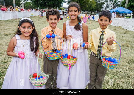 Miami Florida,Hialeah,Milander Park,Easter Egg stravaganza,fair,community Hispanic holiday,festive,tradition,plastic egg hunt,girls,boy boys,male kid Stock Photo