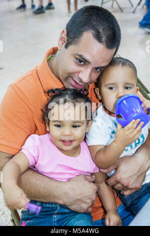 Miami Florida,Hialeah,Milander Park,Easter Egg stravaganza,fair,community Hispanic man men male adult adults,father,parent parents,parent,boy boys,mal Stock Photo