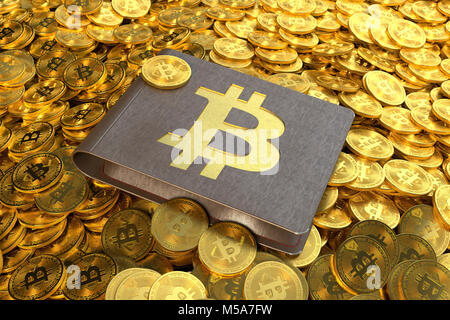 Bitcoin wallet holding Bitcoin cryptocurrency coins lying on a pile of Bitcoins Stock Photo