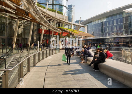 People and tourists in the Porta Nuova, Milan, Italy - the central business district Stock Photo