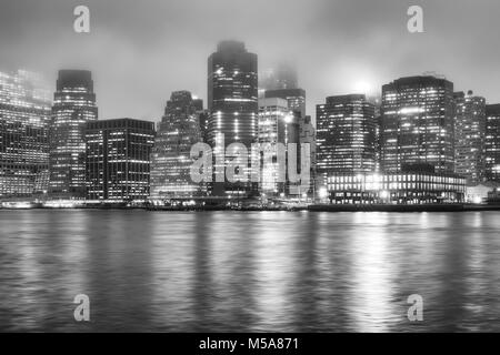 Black and white picture of the Manhattan on a foggy night, New York City, USA. Stock Photo