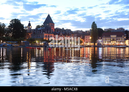 Chateau Ouchy (Château d'Ouchy) on Lake Geneva promenade at evening time, Lausanne, Switzerland Stock Photo
