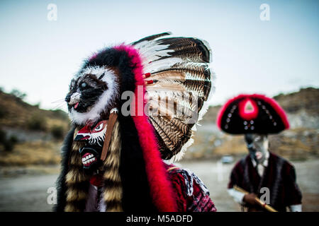 The Pharisees of the Yaqui tribe perform a ritual with masks of strange characters from animals, demons, aliens, extra terrestrials, etc., as part of Lent in Coloso Alto colony in Hermosillo, Sonora, Mexico. Stock Photo