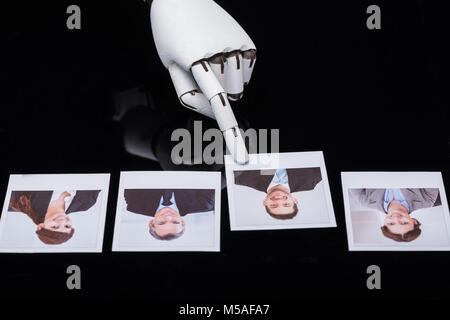 Close-up Of A Robot's Hand Selecting Candidate Photograph Stock Photo