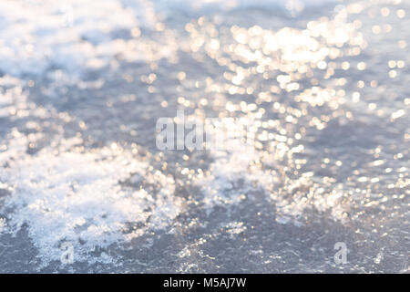 Blurred background of snow on the frozen river, winter time, close Stock Photo