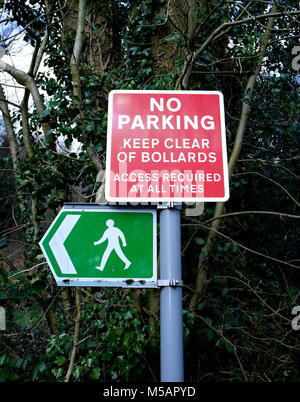 Road sign indicating footpath, no parking, keep clear of bollards, access required at all times Stock Photo