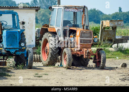 Russia, Temryuk - 15 July 2015: Tractor, standing in a row. Agricultural machinery. Parking of agricultural machinery Stock Photo