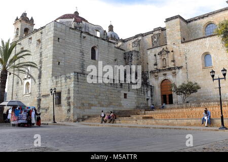 People spend the early evening outside the iconic Cathedral of Our Lady of the Assumption in Oaxaca. Stock Photo