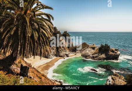 McWay Falls in McWay Creek. Beautiful pacific sand beach with waterfall along the Big Sur coast, California. Stock Photo