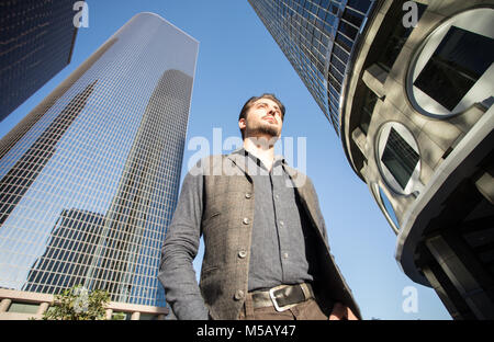 A good looking handsome man walking in the city financial center. Stock Photo