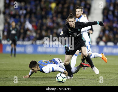 Leganes, Madrid, Spain. 21st Feb, 2018. Bale (Real Madrid) competes for the ball with Bustinza of during the match between Leganes vs Real Madrid at the Estadio Butarque.Final Score Leganes 1 Real Madrid 3. Credit: Manu Reino/SOPA/ZUMA Wire/Alamy Live News