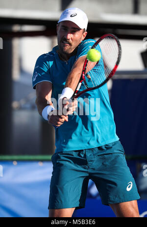 Delray Beach, Florida, USA. 21st Feb, 2018. Steve Johnson, from USA, hits a backhand against Milos Raonic, from Canada, during the 2018 Delray Beach Open ATP professional tennis tournament, played at the Delray Beach Stadium & Tennis Center in Delray Beach, Florida, USA. Steve Johnson won 6-2, 6-4. Mario Houben/CSM/Alamy Live News Stock Photo