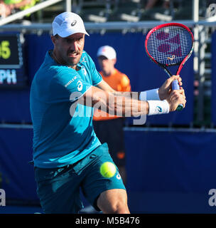 Delray Beach, Florida, USA. 21st Feb, 2018. Steve Johnson, from USA, plays a backhand against Milos Raonic, from Canada, during the 2018 Delray Beach Open ATP professional tennis tournament, played at the Delray Beach Stadium & Tennis Center in Delray Beach, Florida, USA. Steve Johnson won 6-2, 6-4. Mario Houben/CSM/Alamy Live News Stock Photo