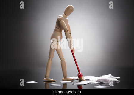 Wooden Dummy Figure Cleaning White Messy Paper On Floor Stock Photo