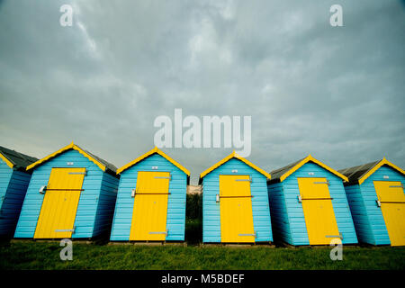 Beach huts at Felpham Greensward on the promenade near Bognor Regis, West Sussex, UK Stock Photo