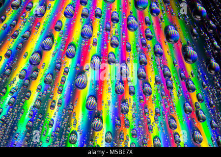 Water droplets on the shiny surface of a DVD. England UK GB Stock Photo