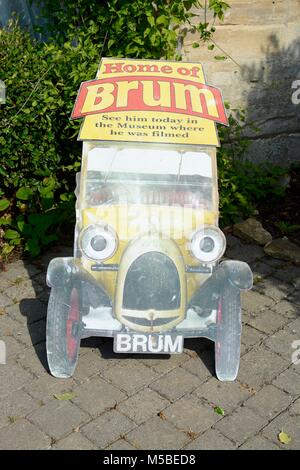 Brum the Children's TV character car, sign outside the motoring museum in Bourton on the Water, Cotswolds, Gloucestershire, UK Stock Photo