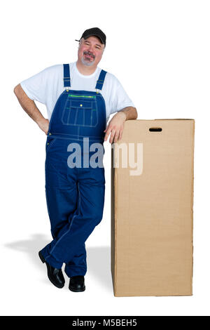 Cheerful delivery man leaning against large cardboard box Stock Photo