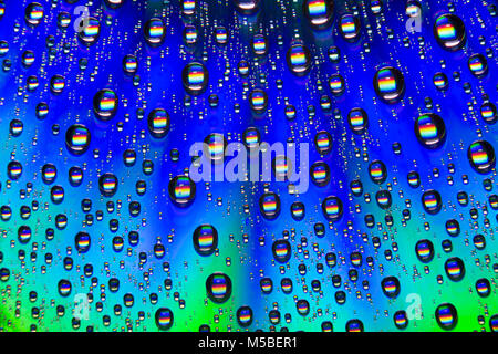 Water droplets on the shiny surface of a DVD. England UK GB Stock Photo