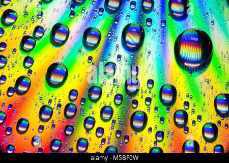 Water droplets on the shiny surface of a DVD. England UK GB Stock Photo