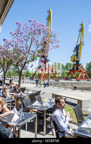 Buenos Aires Argentina,Puerto Madero,Rio Dique,water,riverfront,promenade,cafe,alfresco dining,tables,Hispanic Latin Latino ethnic minority,adult adul Stock Photo