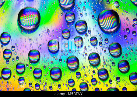 Water droplets on the shiny surface of a DVD. England UK GB Stock Photo