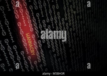 computer virus. binary data shown on black screen with wannacry text hilight with red colour. Stock Photo